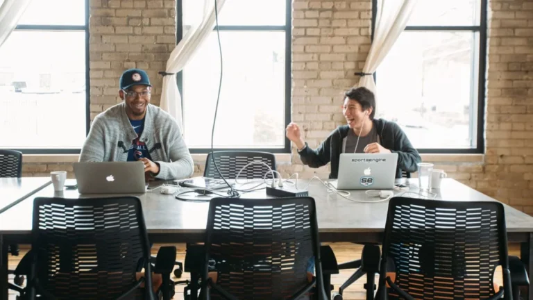 two guys working at a desk